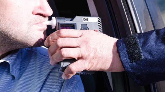 A driver being breathalysed. 