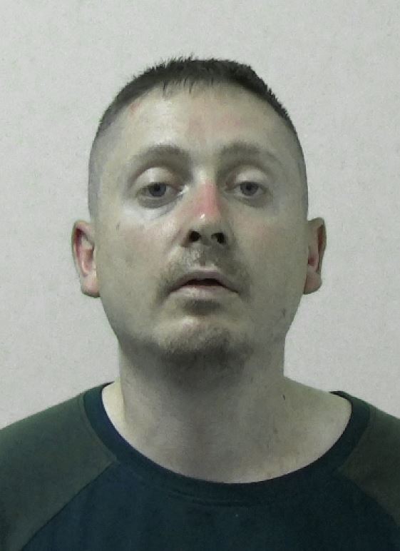A police mugshot of Liam Maughan
