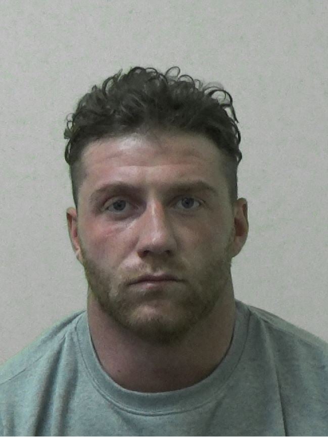 A police mugshot of Jake McIntyre