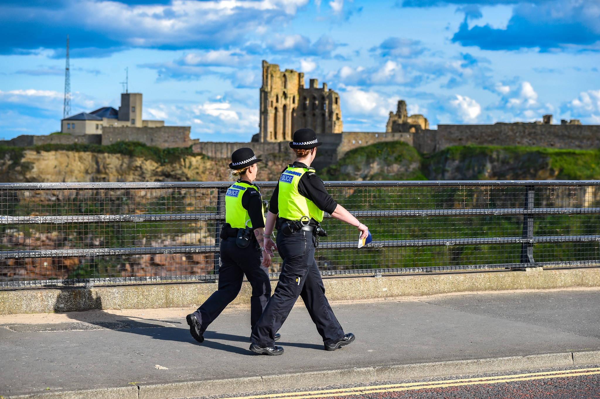 Two officers walking near tynemouth priory