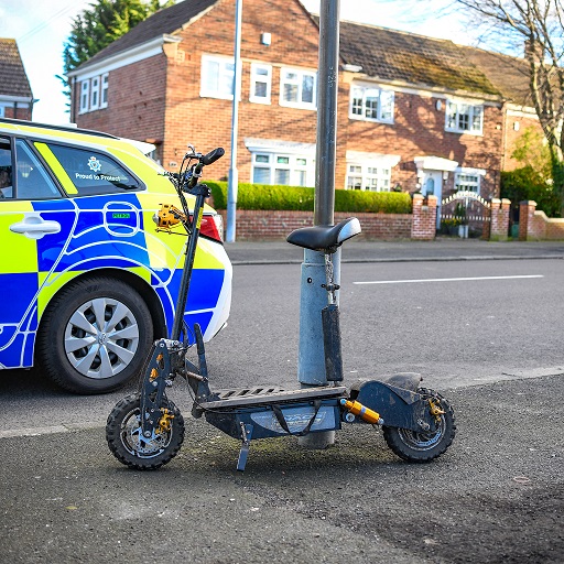 Police car and electric scooter