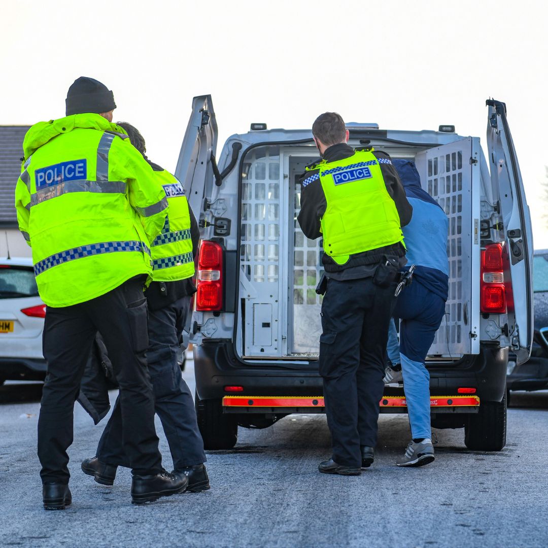 An image of a man being arrested