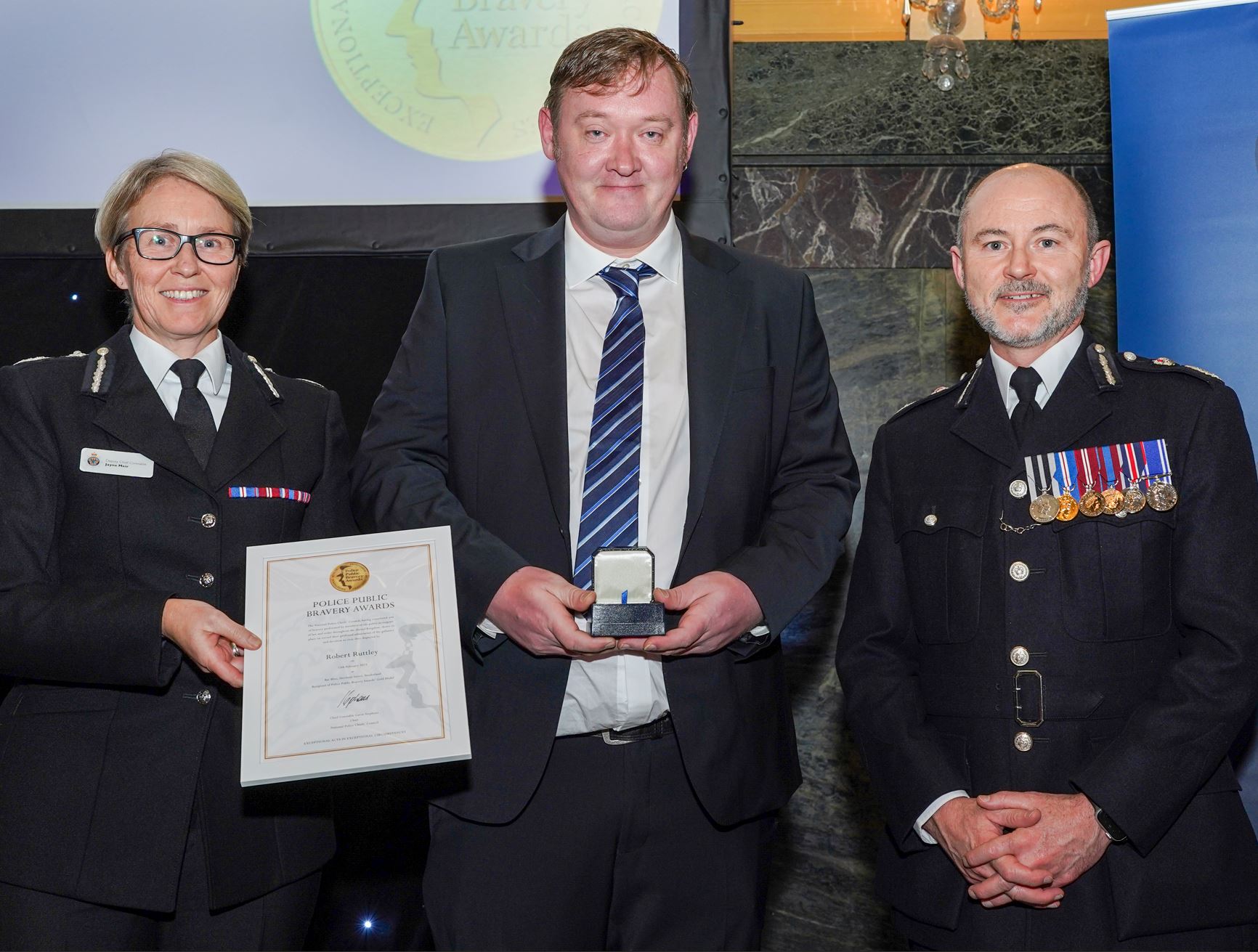 Robert Ruttley receiving his award